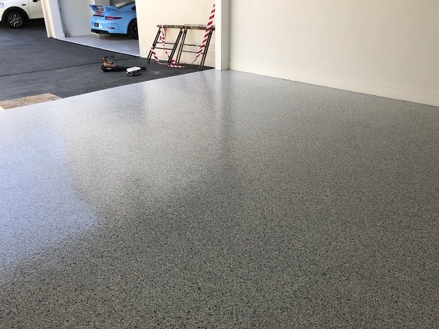 Finished epoxy flake garage floor after remediation